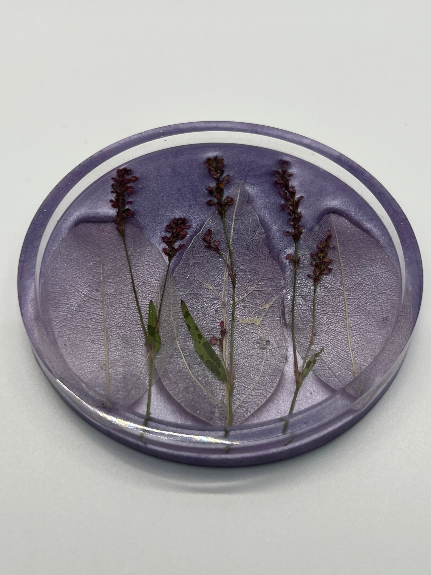 Lavender circle coaster filled with flowers