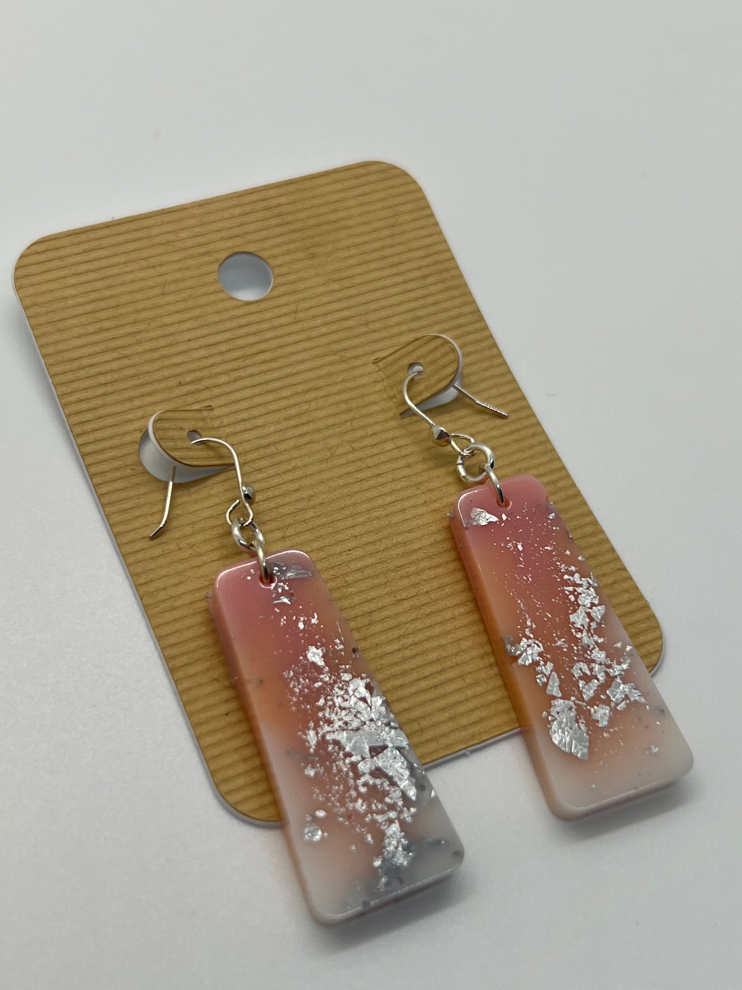 Light pink and white dangle earrings