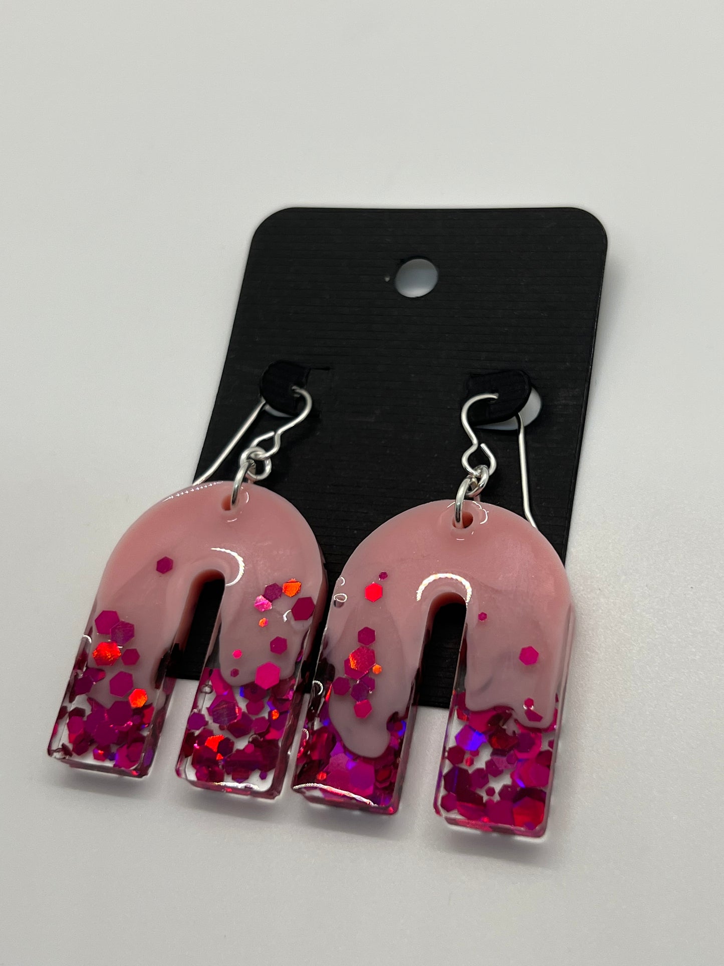 Large pink arch earrings