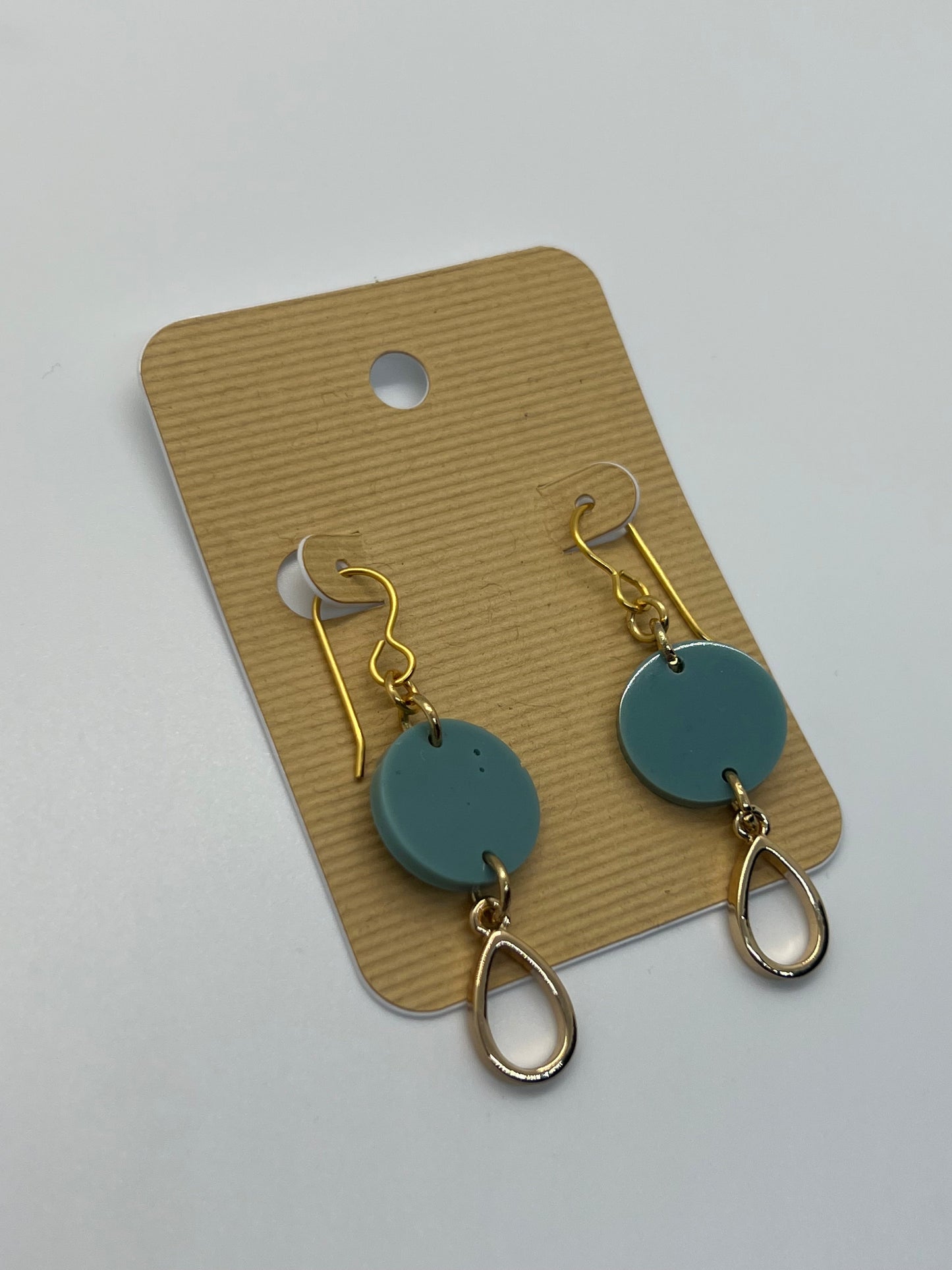 Teal green rounds with tear drop charms