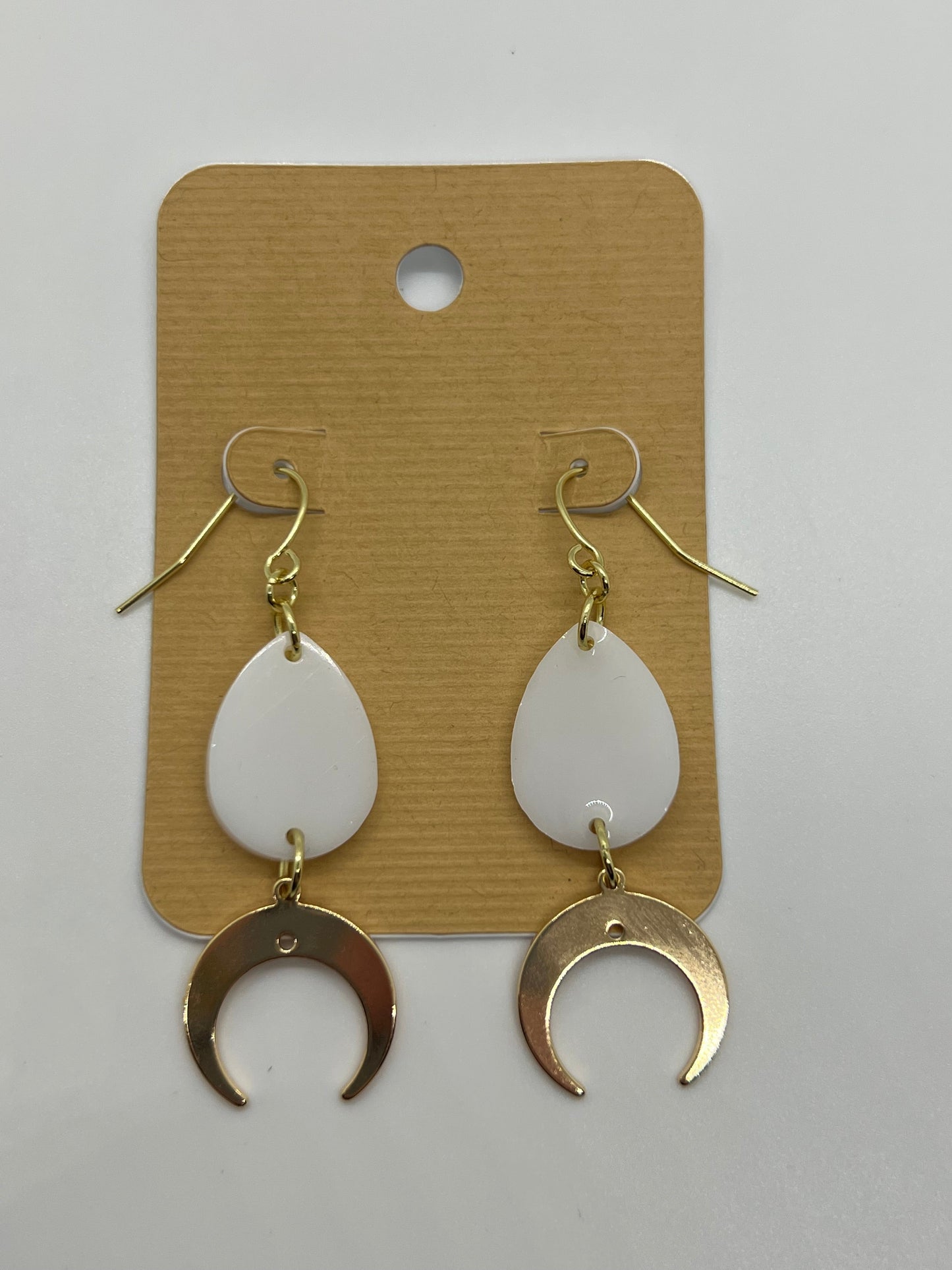 White tear drop with gold crescent moon charm