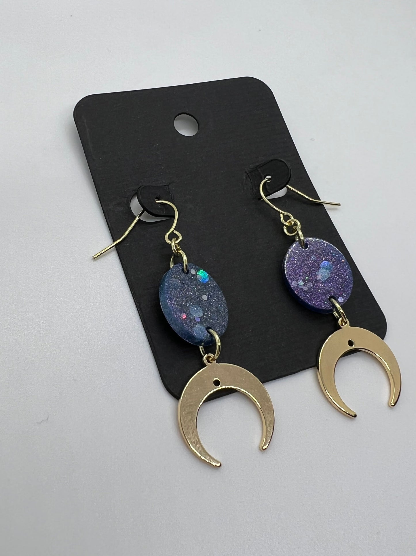 Purple glitter oval with gold crescent moon charm