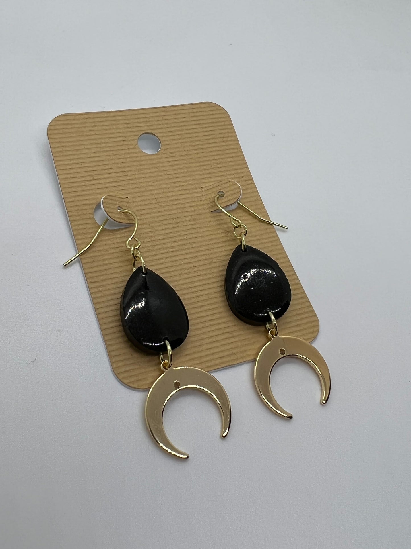 Black tear drop with gold crescent moon charm