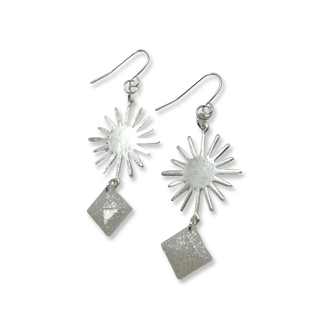 Silver sun charm with white glittery squares