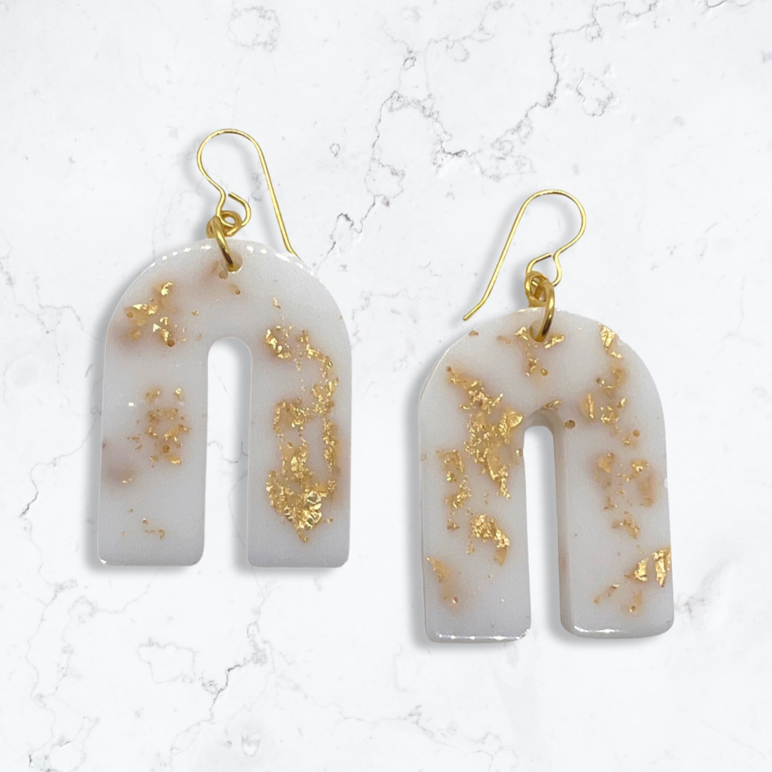 White arch earrings with gold flakes