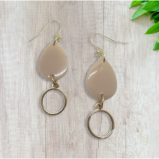 Beige tear drop with small round charm