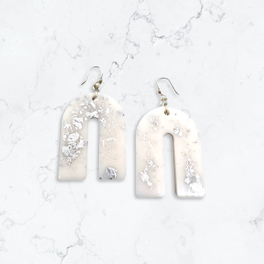 White arch earrings with silver flakes